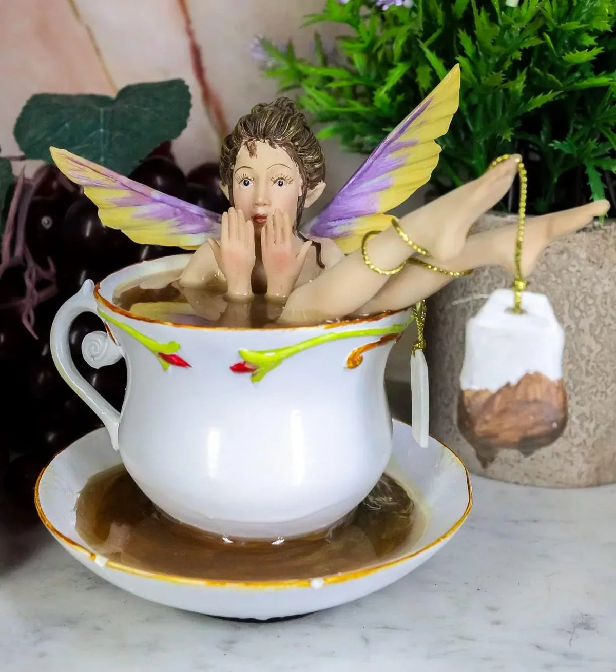Ebros Magical Encounters Shocked Fairy Bathing In Tea Cup With Cracked Saucer Design Figurine 5" H Fantasy Collectible Tea Time Fairy With Tea Bag